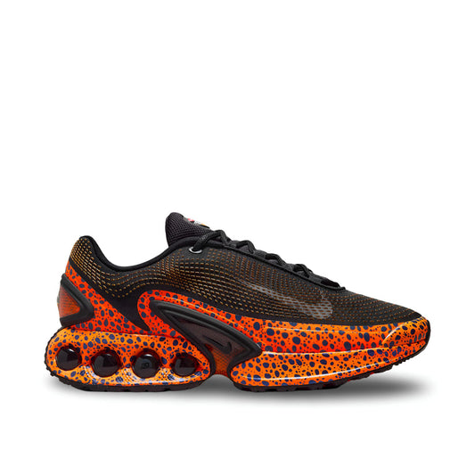 "Nike Air Max DN SE Premium Safari sneaker with black upper and orange safari print overlays"

"Side view of Nike Air Max DN SE Premium Safari with visible Dynamic Air unit and Phylon midsole"

"Close-up of Nike Air Max DN SE Premium Safari sneaker with reflective details and debossed Nike Air logo"

"Nike Air Max DN SE Premium Safari – bold heritage-inspired sneaker with adaptive cushioning"