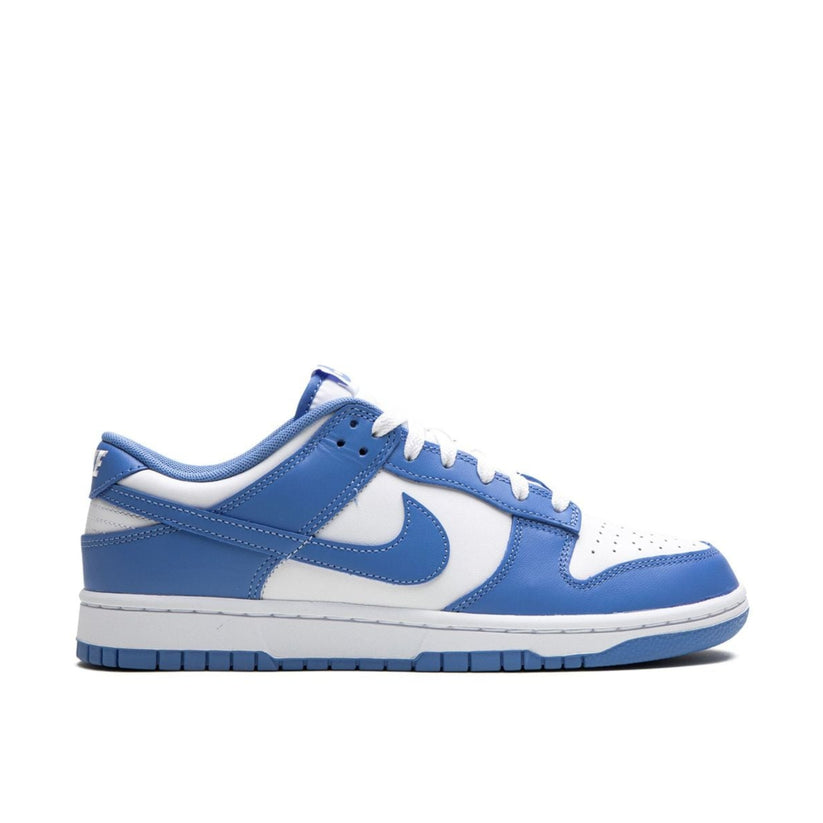 Nike Dunk Low Polar Blue sneaker with white leather base and blue overlays"

"Side view of Nike Dunk Low Polar Blue with mesh tongue and blue rubber outsole"

"Close-up of Nike Dunk Low Polar Blue showing embroidered Nike branding and two-tone design"

"Nike Dunk Low Polar Blue – classic sneaker with fresh white and blue colorway"