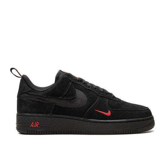 "Nike Air Force 1 '07 LV8 Black Light Crimson sneaker with black suede upper and reflective cut-out Swoosh"

"Side view of Nike Air Force 1 '07 LV8 Black Light Crimson with braided laces and crimson accents"

"Close-up of Nike Air Force 1 '07 LV8 Black Light Crimson showing perforated toe box and Nike Air heel branding"

"Nike Air Force 1 '07 LV8 Black Light Crimson – sleek black sneaker with subtle crimson highlights"