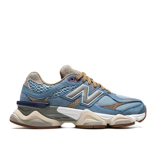 "New Balance x Bodega 9060 Age of Discovery sneaker with brown shaggy suede and light blue overlays"

"Side view of Bodega New Balance 9060 Age of Discovery with purple eyelets and fluorescent yellow tongue tab"

"Close-up of New Balance x Bodega 9060 Age of Discovery sneaker showing ABZORB and SBS sole"

"Limited edition New Balance 9060 Age of Discovery sneaker with Renaissance-themed packaging"