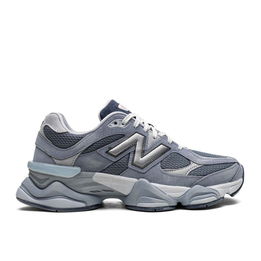 "New Balance 90/60 Moon Daze sneaker with grey suede and blue mesh upper"

"Side view of New Balance 90/60 Moon Daze with sculpted dual-density midsole"

"Close-up of New Balance 90/60 Moon Daze sneaker showing embroidered logos and chunky outsole"

"New Balance 90/60 Moon Daze – futuristic Y2K-inspired lifestyle sneaker"