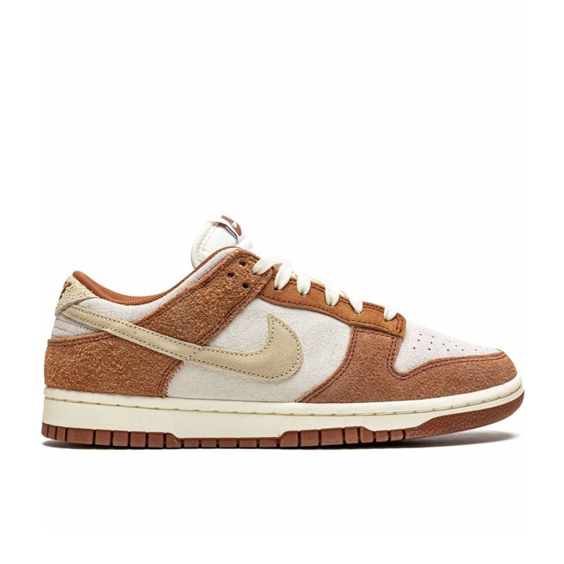 "Nike Dunk Low PRM Medium Curry sneaker with full suede upper in sail and medium curry brown" .

"Side view of Nike Dunk Low Medium Curry showing fossil-colored Swoosh and sail midsole" .

"Close-up of Nike Dunk Low Medium Curry with rich suede textures and detailed stitching" .

"Nike Dunk Low PRM Medium Curry – a premium brown suede sneaker with a classic silhouette" .
